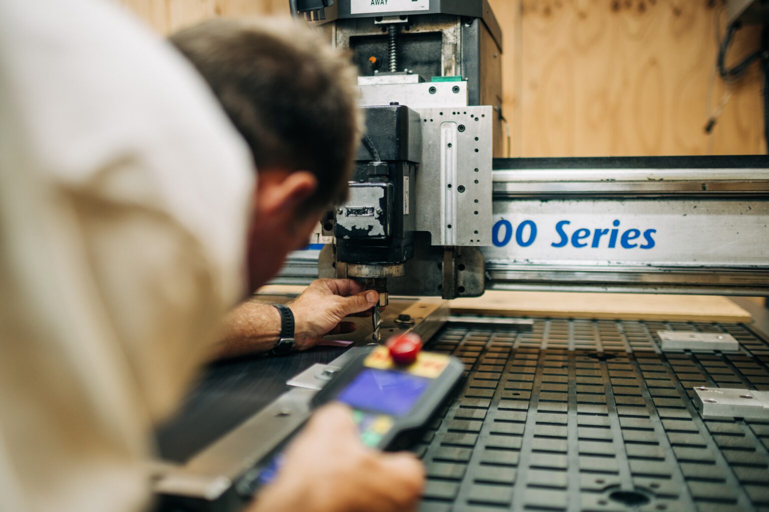A PODCAD technician operating the CNC milling machine